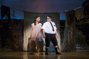 Kim Exum as Nabulungi and Cody Jamison Strand as Elder Cunningham in The Book of Mormon.
© Julieta Cervantes