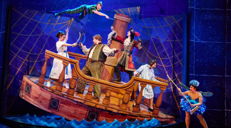 Cast of Peter Pan Goes Wrong on tilting pirate ship.