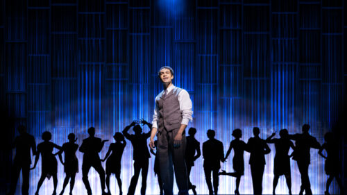 Noah J. Ricketts as Nick Carraway and the cast of The Great Gatsby.