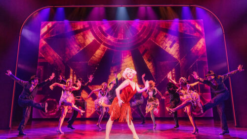 Robyn Hurder as Ivy and the cast of Smash. © Matthew Murphy