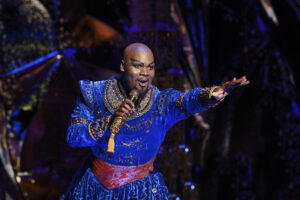Michael James Scott as Genie in Aladdin.