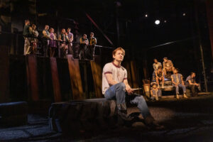 Trevor Wayne as Ponyboy Curtis and the cast of The Outsiders.
© Matthew Murphy